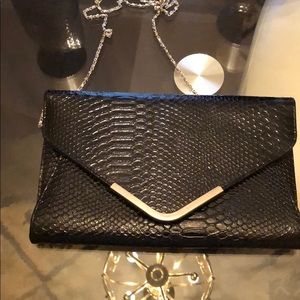Ashley Stewart Python envelope handbags NWOT